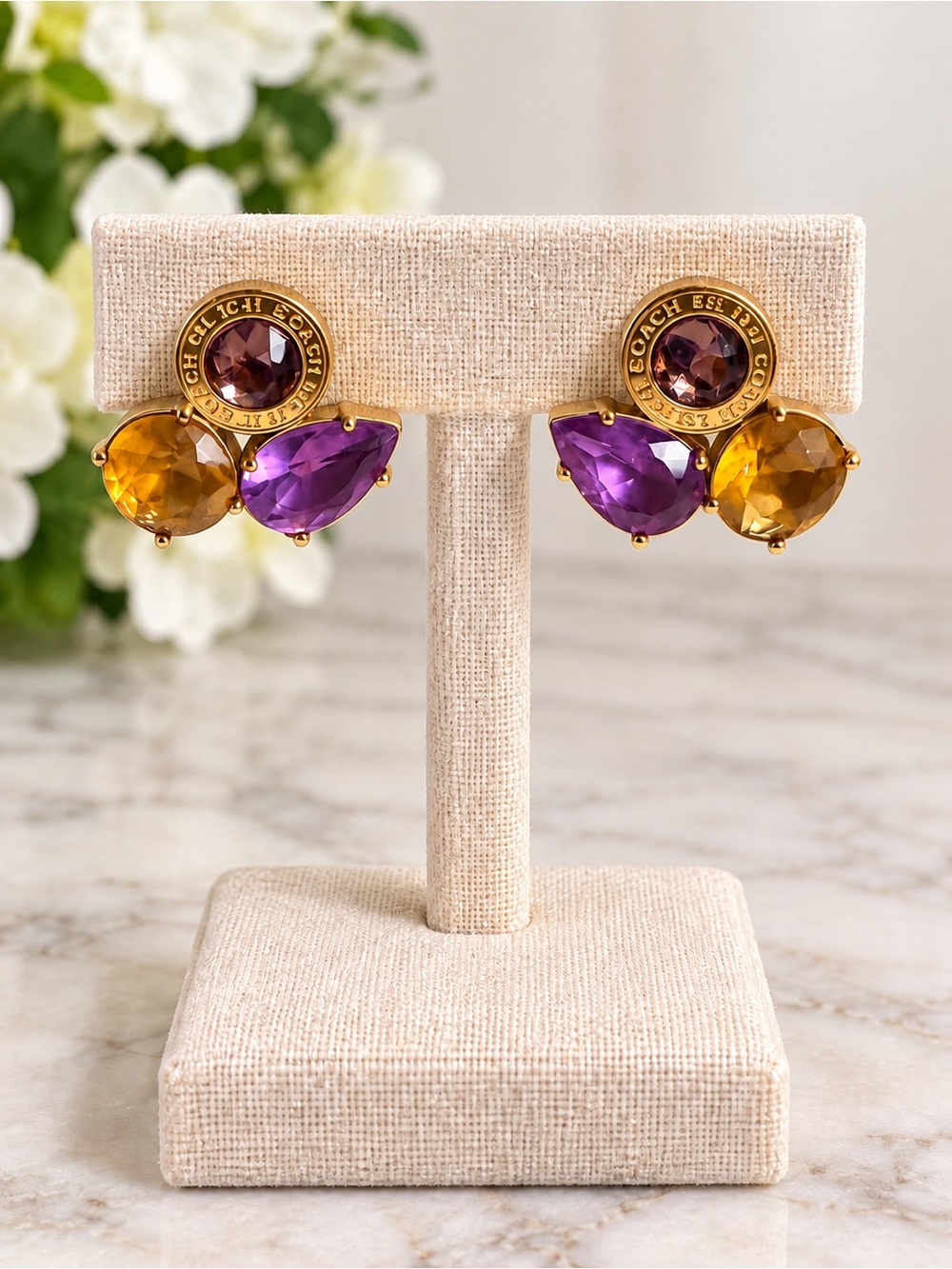 Coach Gold-Tone Earrings with Purple and Amber Stones.